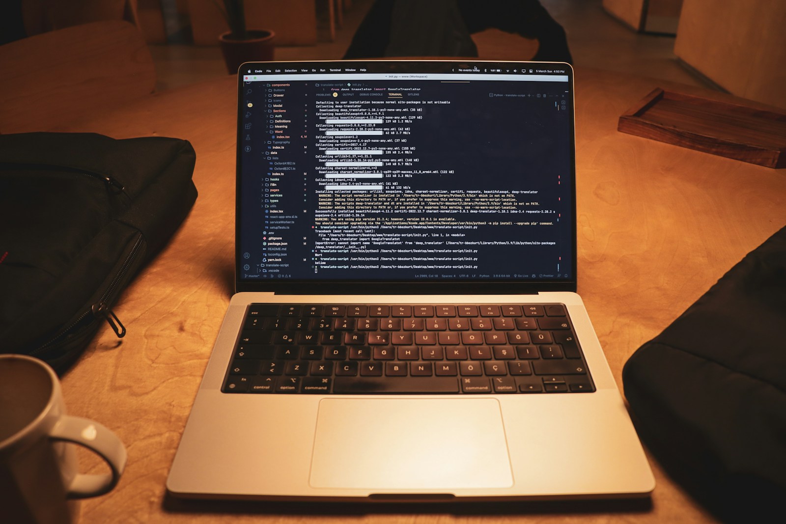 a laptop computer sitting on top of a wooden table