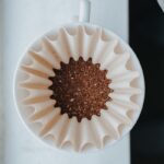 white muffin tray on top of white ceramic mug